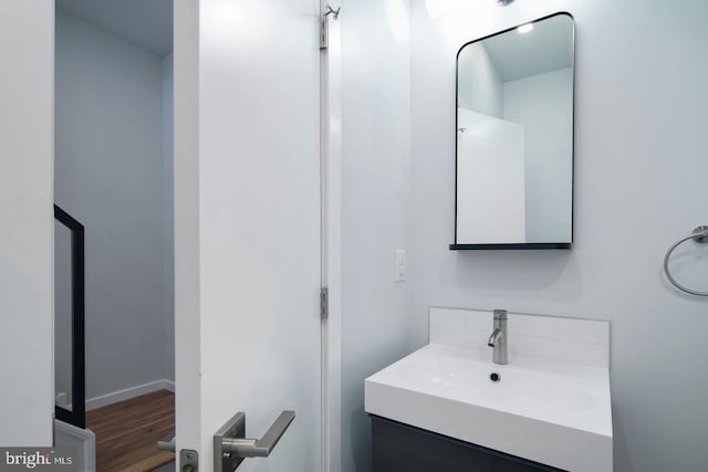 bathroom with vanity and hardwood / wood-style flooring