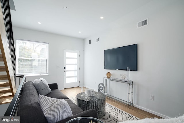 living room with light hardwood / wood-style floors