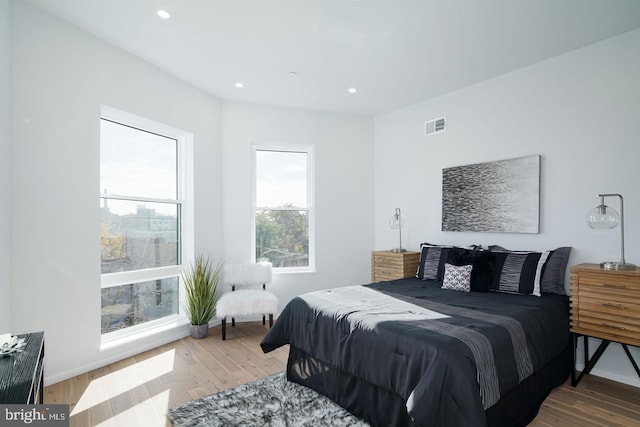 bedroom with hardwood / wood-style flooring