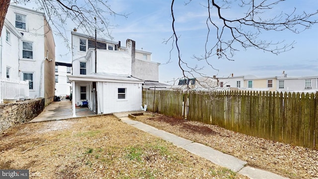 rear view of property featuring a patio area