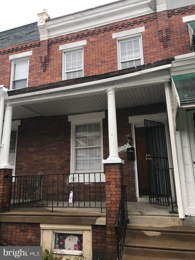 entrance to property with a porch