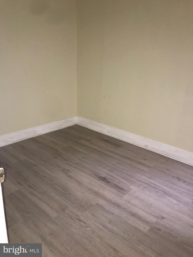 spare room with hardwood / wood-style floors