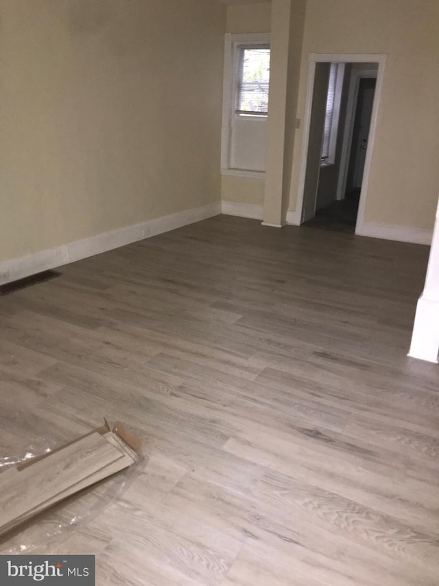 spare room featuring light wood-type flooring