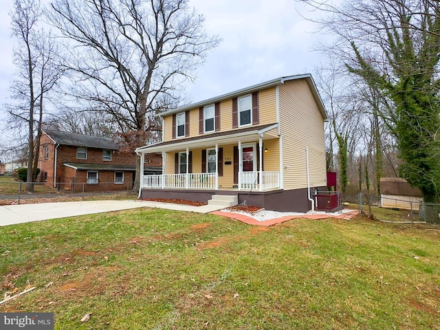 view of front facade with covered porch and a front yard