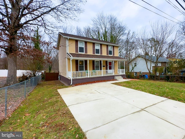 view of front of property with covered porch and a front lawn