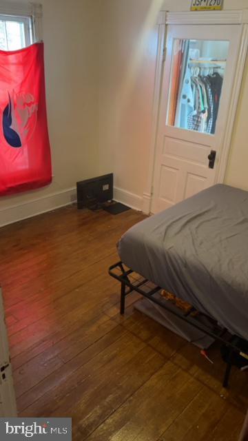 bedroom featuring dark wood-type flooring