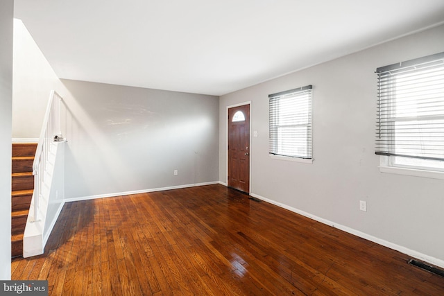 entrance foyer featuring dark hardwood / wood-style flooring and plenty of natural light