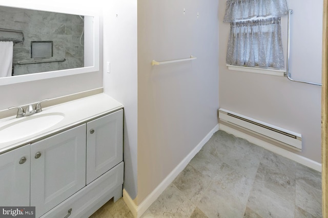 bathroom with vanity and baseboard heating