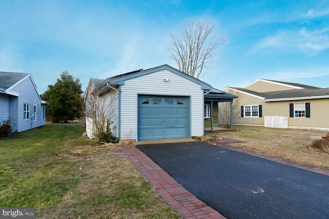 ranch-style home with a garage and a front yard