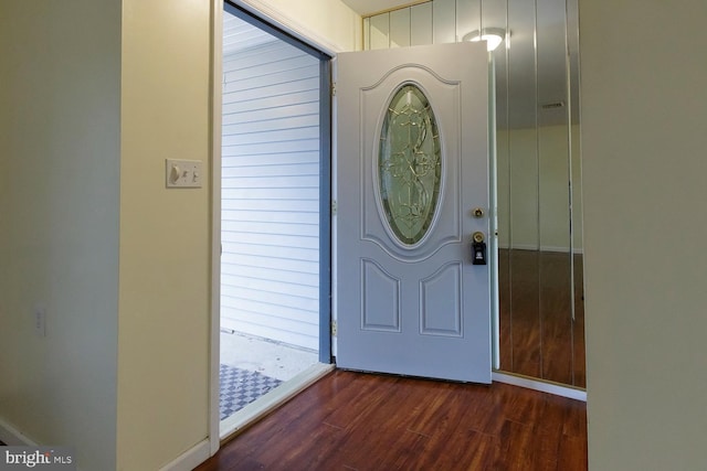 foyer entrance featuring dark hardwood / wood-style floors