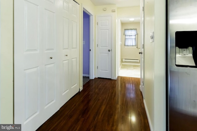 hall featuring a baseboard radiator and dark hardwood / wood-style floors