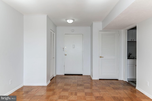 corridor with light parquet flooring