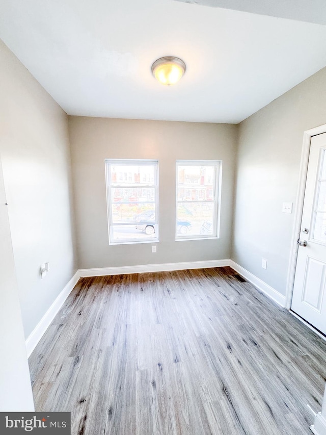 empty room with light hardwood / wood-style floors