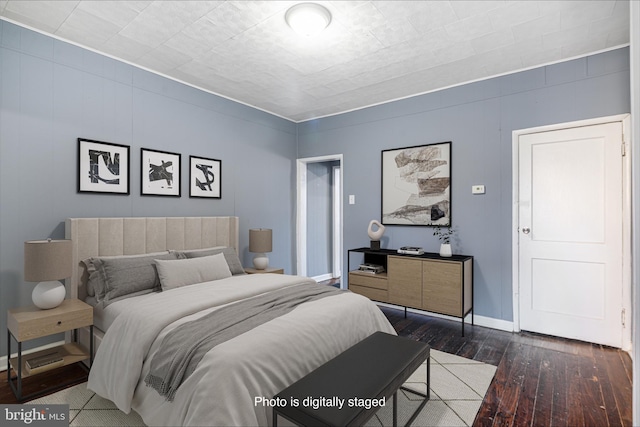 bedroom featuring dark wood-type flooring