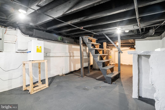 basement featuring gas water heater and electric panel