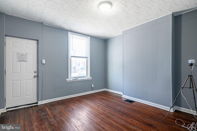 entrance foyer featuring dark wood-type flooring