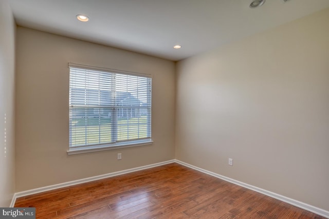 unfurnished room featuring hardwood / wood-style floors