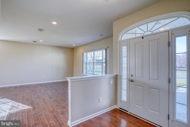 foyer entrance featuring hardwood / wood-style flooring and plenty of natural light