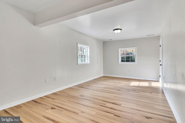 unfurnished room with light hardwood / wood-style floors