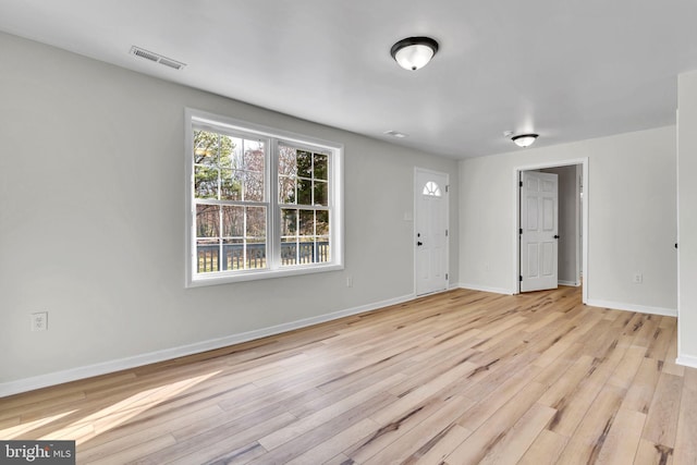 empty room with light wood-type flooring