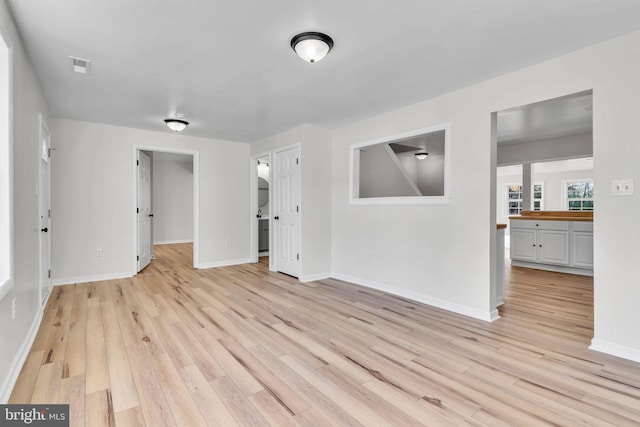 spare room with light hardwood / wood-style floors