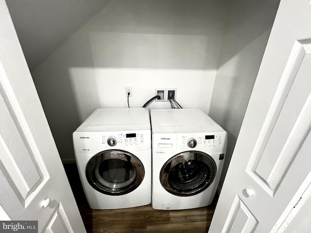 laundry area with washer and clothes dryer and hardwood / wood-style flooring