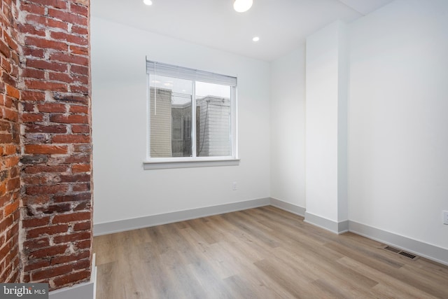 empty room with light wood-type flooring