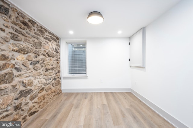 empty room with light hardwood / wood-style floors