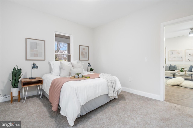 bedroom with light colored carpet