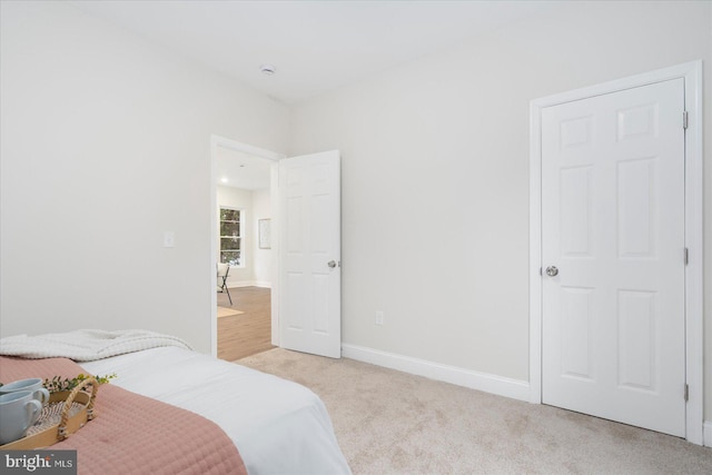 bedroom with light carpet