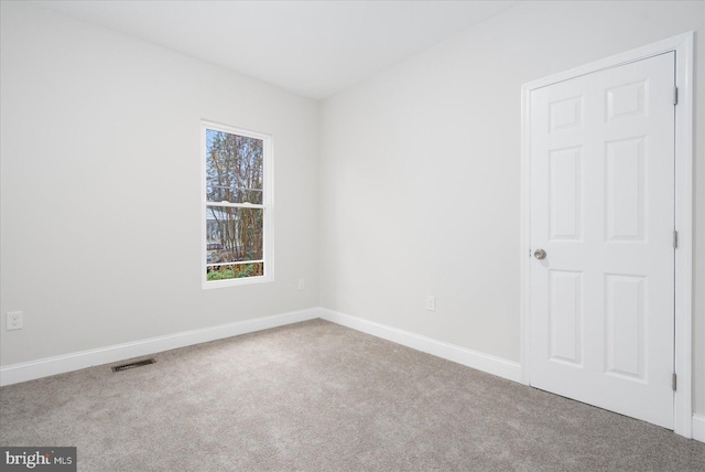 empty room featuring carpet floors