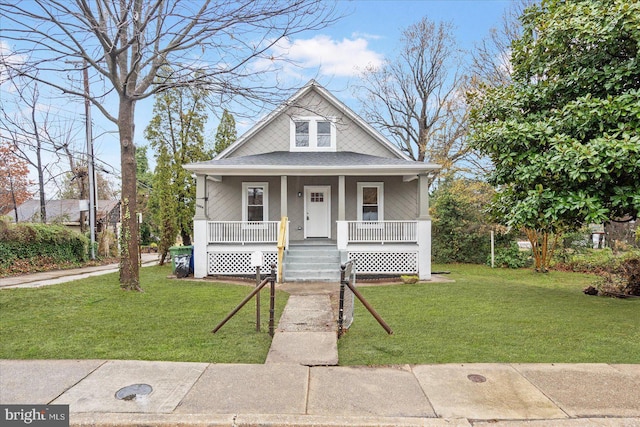 view of front of house with a front lawn and a porch