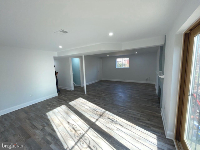 basement with dark wood-type flooring