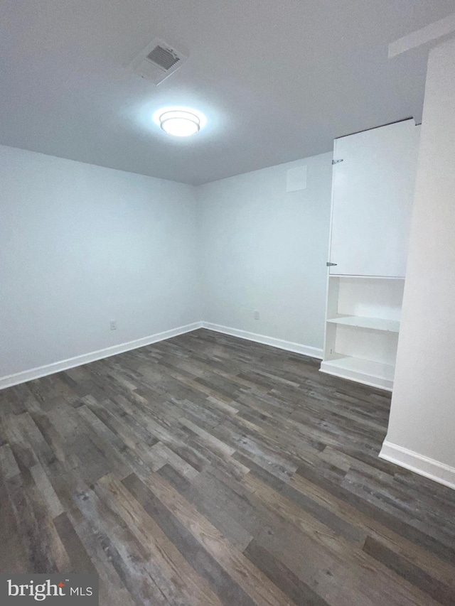 basement with dark wood-type flooring