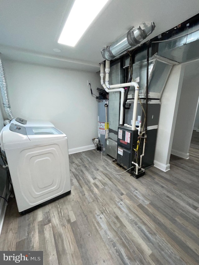 utilities featuring washer and dryer and gas water heater