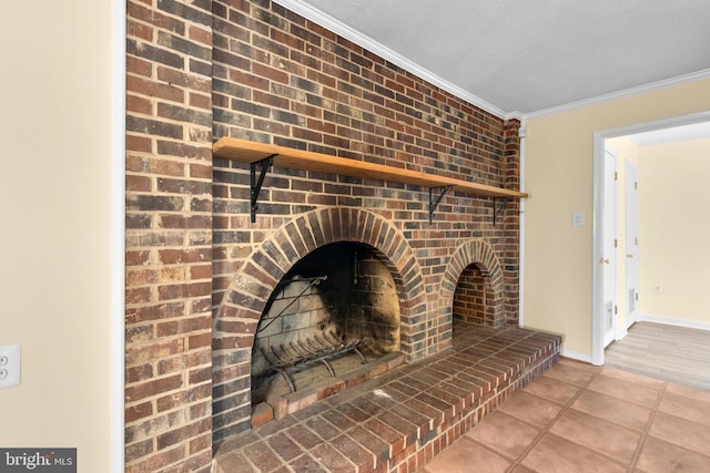 room details featuring baseboards, a brick fireplace, and ornamental molding