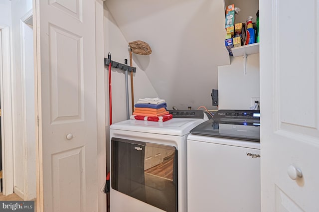 clothes washing area featuring washing machine and clothes dryer