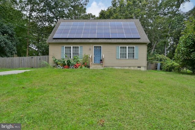 view of front facade with solar panels and a front yard