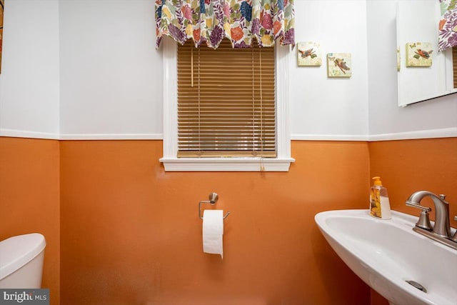 bathroom featuring sink and toilet