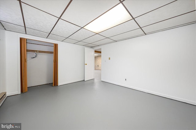 basement featuring a drop ceiling