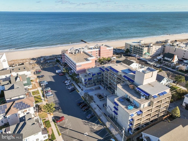 bird's eye view featuring a beach view and a water view