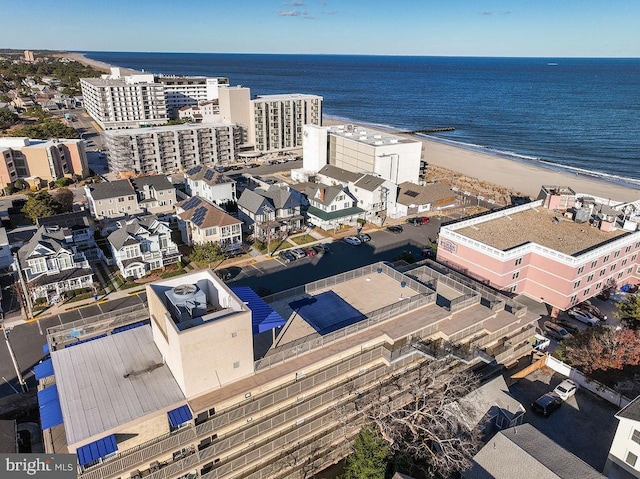 bird's eye view featuring a water view and a view of the beach