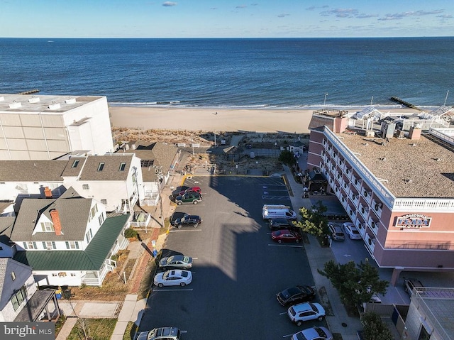 aerial view featuring a water view and a view of the beach