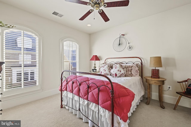 bedroom with light colored carpet and ceiling fan