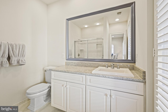 bathroom featuring tile patterned floors, vanity, toilet, and an enclosed shower