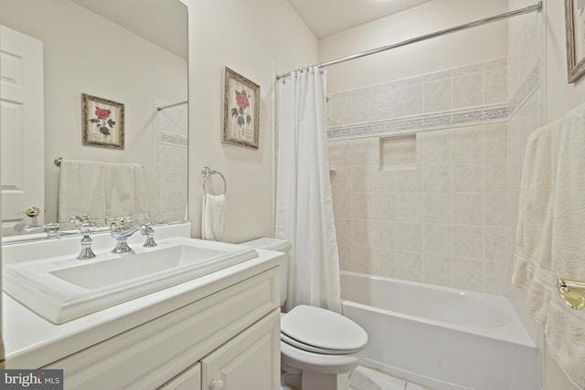 full bathroom featuring tile patterned flooring, vanity, toilet, and shower / bathtub combination with curtain