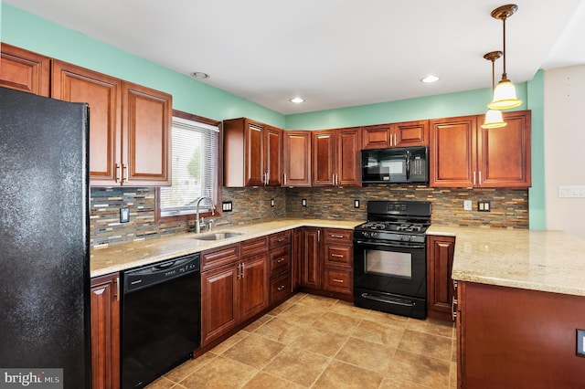 kitchen with decorative light fixtures, sink, decorative backsplash, and black appliances