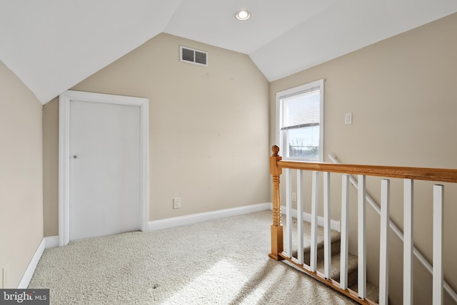 additional living space with carpet and lofted ceiling