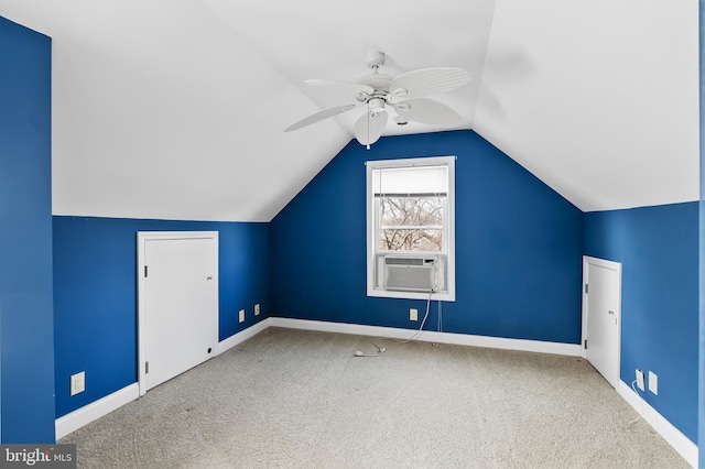 additional living space with ceiling fan, vaulted ceiling, carpet, and cooling unit