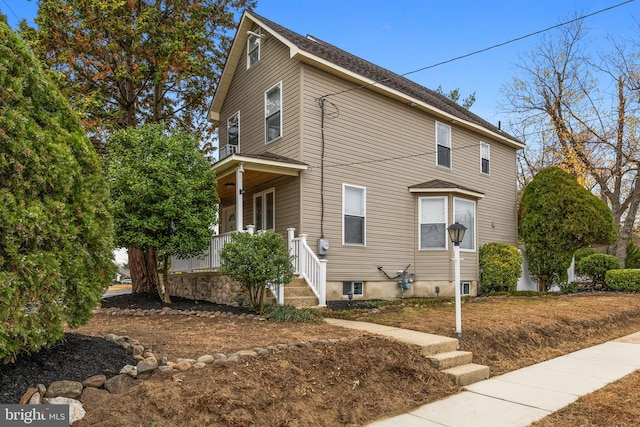 view of property exterior with a porch